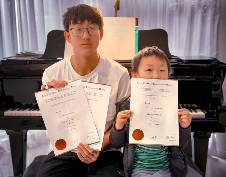 Students holding certificates